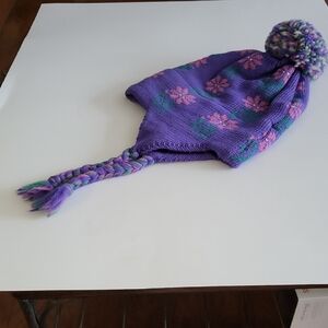 Purple Knit Hat with Pom Pom and Braided Tassels. Mountain Ladies & Ewe.
